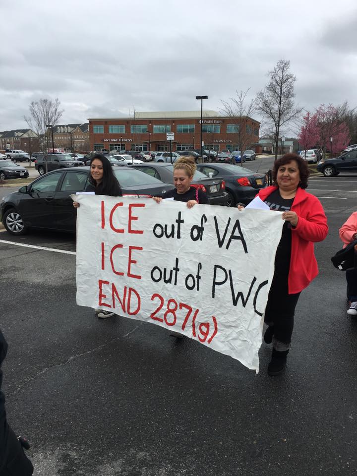 protesters holding a sign that says "ICE out of VA, ICE out of PWC, END 287g"